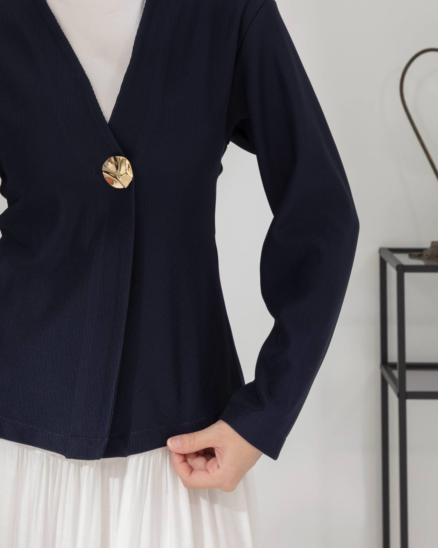 veste à bouton doré